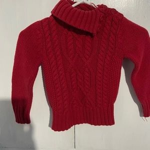 Red cowl neck or high neck sweater